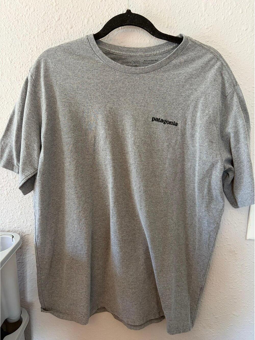 Men's Patagonia grey tshirt size L. Normal wear and logo cracking close up
